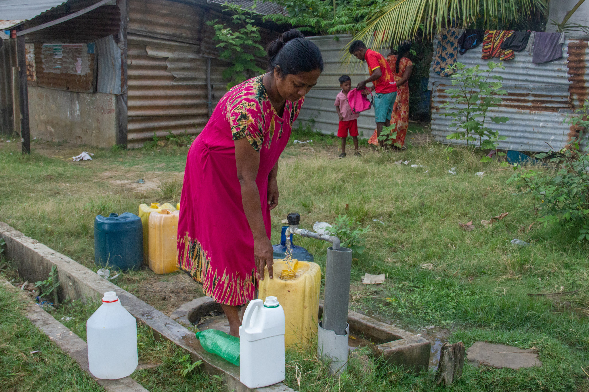 Community members around a new clean water well